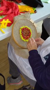 photo of students making a rag rug